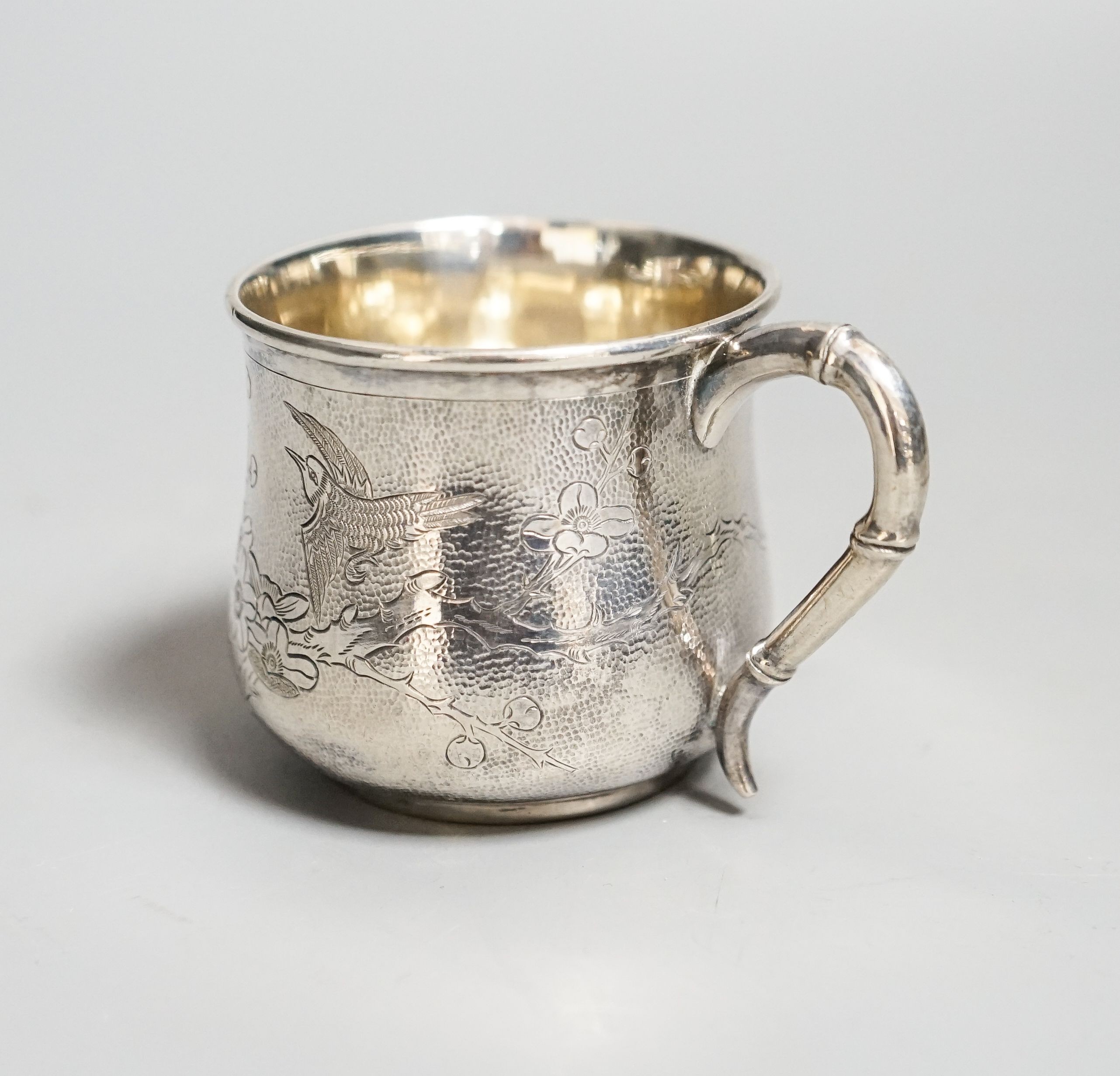 A Chinese white metal christening mug, by Zee Sung, 55mm.